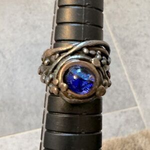 Handmade one of a kind ring.  Size 6. Fused glass blue center bronze